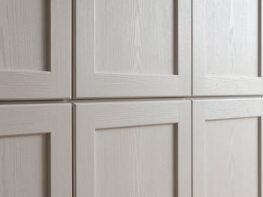Close-up of rift-sawn white oak cabinetry with perfectly aligned grain, soft diffused side-light, sharp focus, 35mm lens, architectural interior photography