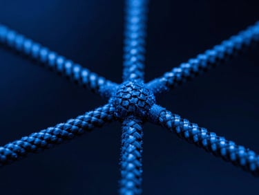 Extreme close-up macro photography of carbon nanostructures forming under high-contrast cool blue studio lighting, 35mm