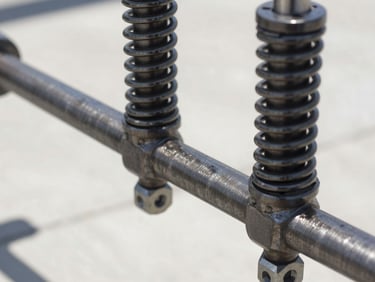 Close-up of a newly installed dual torsion spring system on a clean steel shaft, sharp focus, natural daylight