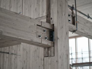 A close-up of sustainable mass timber architectural joints, sharp focus, cool overcast daylight, slate gray tones.