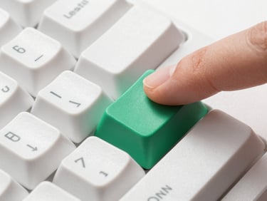 Macro shot of a mechanical keyboard keycap being pressed by a finger, home row position, clean studio lighting, high contrast.