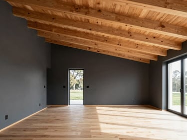Modern cabin interior with matte charcoal accent walls, soaring ceilings with exposed clean timber beams, bright natural daylight.
