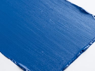 Close-up of a vibrant industrial paint swatch, showcasing deep color and excellent coverage, with a subtle texture. Bright studio lighting, sharp focus on the paint film, minimalist composition, 35mm.