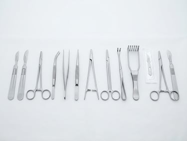 bright high-key product photography of neatly organized surgical instruments on a sterile white surface, crisp studio light, clinical precision, sharp focus, 85mm