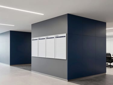 A bright, modern corporate workspace with structured planners and clean architectural lines, neutral daylight, deep navy and slate gray accents