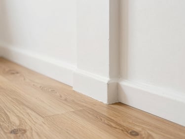 Close-up of microcement meeting oak wood floor, clean architectural detail, natural lighting