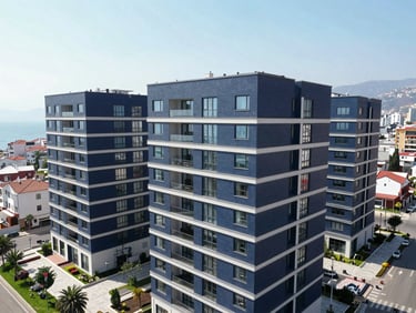 High-angle drone shot of modern residential buildings in Antalya Muratpaşa, bright Mediterranean daylight, clean corporate blue tones, 35mm lens