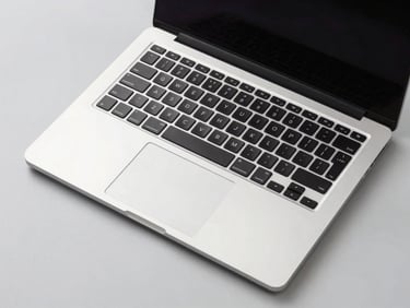 Top-down view of a sleek, modern laptop open on a clean desk, natural light, crisp studio lighting, light gray background, sharp details