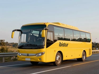 Bright yellow Ibistur tourism bus traveling on a scenic highway during a warm golden hour, professional commercial photography, 35mm