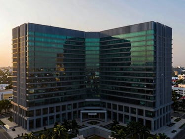 Wide environmental shot of a modern architectural corporate headquarters in Bengaluru during golden hour, clean geometric lines, high-contrast shadows, 35mm photography