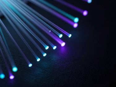 Abstract close-up of glowing fiber optics, sharp cyan and violet laser-line accents, dark slate tones, macro depth of field.