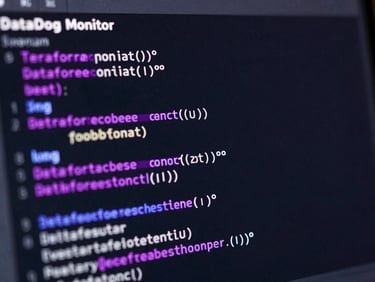 Macro screenshot of a visual Terraform code block configuring a DataDog monitor, dark mode IDE interface, purple and magenta syntax highlighting, sharp focus, low-key digital glow