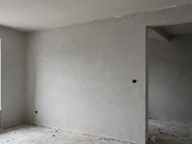 Crisp architectural photography, sharp drywall joints in a modern unfinished room, desaturated slate tones, natural overcast daylight, 35mm lens.