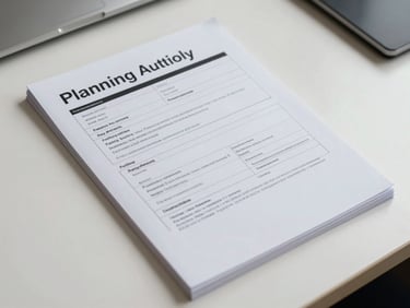 Overhead shot of a planning application document pack on a clean desk, planning authority reference numbers visible, even LED lighting, no people