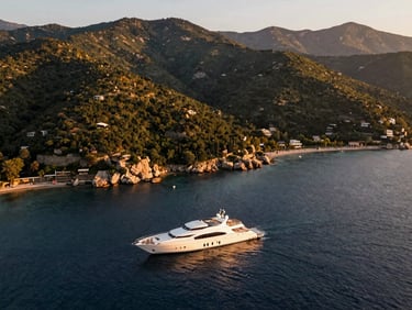Scenic drone shot of Yalova coastline at golden hour, luxury yacht in the foreground, lush green hills in the background, warm light