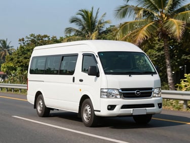 Clean white minibus on a highway, bright daylight, clear sky.