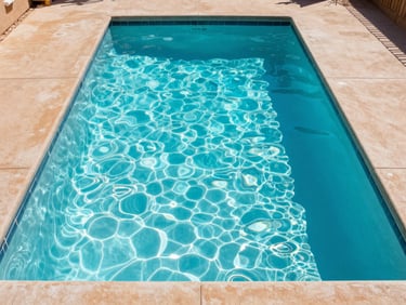 Bright outdoor photography of a pristine residential swimming pool in Phoenix, sparkling turquoise water, warm sand-colored concrete decking, sharp focus, 35mm