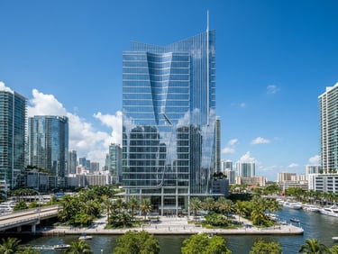 Wide-angle architectural photograph of a modern glass office building in Miami, bright natural Florida daylight, clean high-contrast tones, professional editorial style