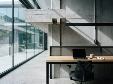 Modern architectural detail of a Silicon Valley workspace interior, clean concrete lines, sharp daylight, cool desaturated tones with high contrast