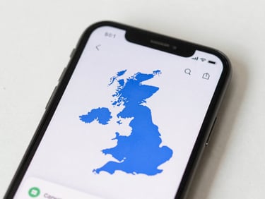A close-up of a smartphone screen showing a UK network coverage map, bright neutral daylight, clean minimalist photography