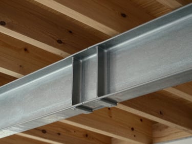 Architectural detail of a heavy steel beam connection to a timber ceiling joist, clean and minimal.