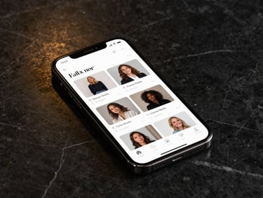 A smartphone displaying social media feed with elegant sponsored posts on a dark marble surface, soft golden reflections