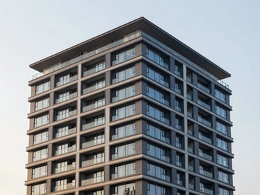 Modern high-end apartment building exterior during golden hour, clean architectural lines, professional editorial photography