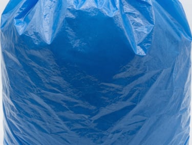 Close-up of thick, high-gauge royal blue plastic bag texture, studio light, sharp focus, macro lens.