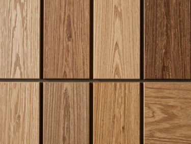 Extreme close-up overhead flat-lay of mixed Baltic hardwood timber samples arranged side by side under even neutral studio light, contrasting grain patterns and tones, no figures, no text