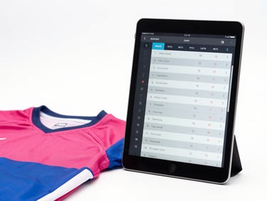 A modern tablet displaying a team outfitting roster interface next to a clean jersey, high-key light