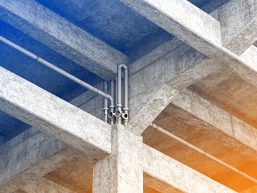 Detailed BIM coordination model showing fire sprinkler lines and plumbing risers intersecting structural concrete beams, vector wireframe overlay