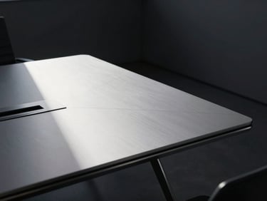 Minimalist corporate boardroom table with sharp geometric shadows, cool silver tones, 35mm