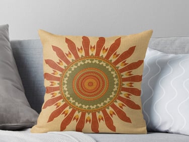 Throw pillow with vintage orange and yellow mandala.