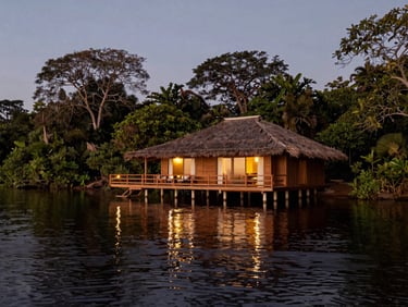 A luxury floating lodge anchored on a quiet Amazon river bend at dusk, warm lights reflecting on the black water, pristine nature surrounding.