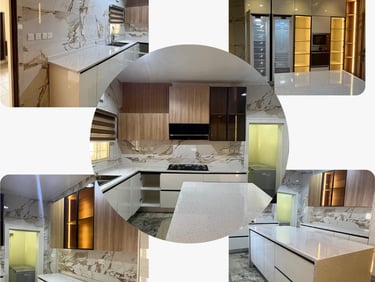 Modern luxury kitchen featuring white quartz countertops, marble walls, and sleek integrated cabinetry.