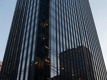 Low-angle shot of a modern glass skyscraper in Mexico City, sharp corporate architecture, cool daylight, deep navy tones