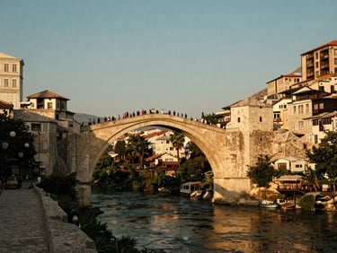 Historic bridge in Mostar, Bosnia and Herzegovina, at golden hour, uncrowded, warm editorial travel photography, rich saturated tones.