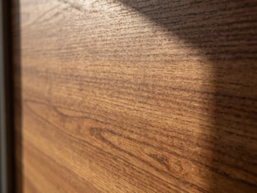 Close-up of rich wood grain texture showing a smooth matte varnish finish under warm afternoon sun, 35mm lens.