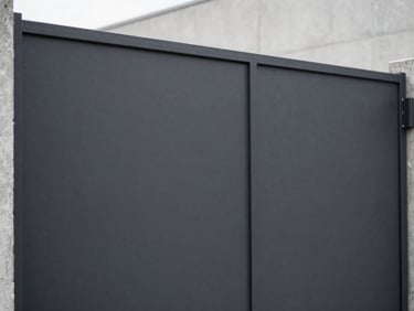 Close-up of a dark charcoal textured steel surface on a modern gate, clean orthogonal lines, soft daylight, desaturated industrial tones, 35mm lens