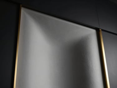 Low-angle view of a curved plaster acoustic cove, smooth matte texture, dramatic side lighting casting soft gradients of shadow