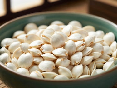 Macro shot of crisp white makhana seeds in a handmade ceramic bowl, soft shadow, elegant lighting