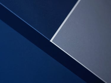 Close-up of geometric abstract data visualization on a screen, clean architectural lines, deep blue and slate tones