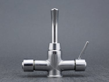 Straight-on industrial photography of a clean, automated faucet assembly line, cool metallic tones, sharp highlights, slate gray background