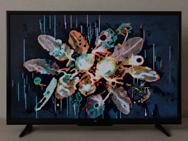 Close-up of a TV screen showing a cluster of dead pixels and vertical lines on an otherwise lit display, studio strobe lighting, sharp focus on the pixel fault, neutral background