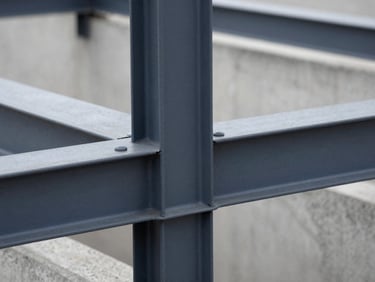 Close-up of modern pre-fabricated concrete and steel structural joints, sharp focus, natural daylight