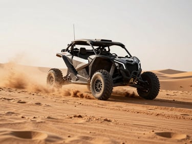 Dynamic action shot of a charcoal Can-Am Maverick kicking up a massive red-dirt roost in the Sand Hollow dunes, harsh high-contrast desert sunlight.