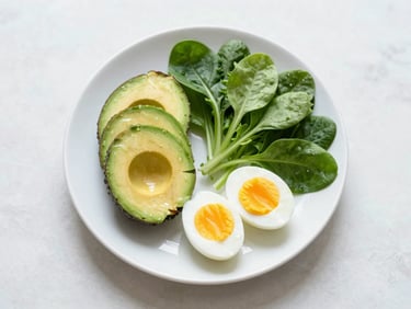 A balanced colorful plate with avocado, soft boiled egg, and fresh greens, overhead flatlay, bright daylight