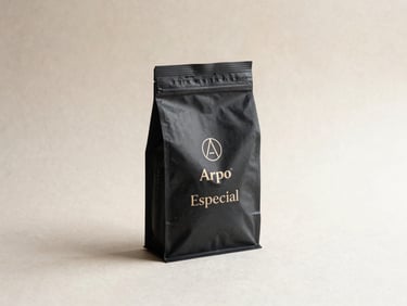 Close-up of Arpo Cafe Especial Black package on a textured off-white surface, soft side light