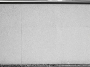 Infrared thermal image of a perfectly insulated modern wall, showing uniform temperature distribution, cool desaturated tones, sharp focus.