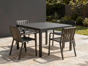 Sleek minimalist outdoor metal dining set on a stone patio, warm sunlight casting geometric shadows, modern garden design.